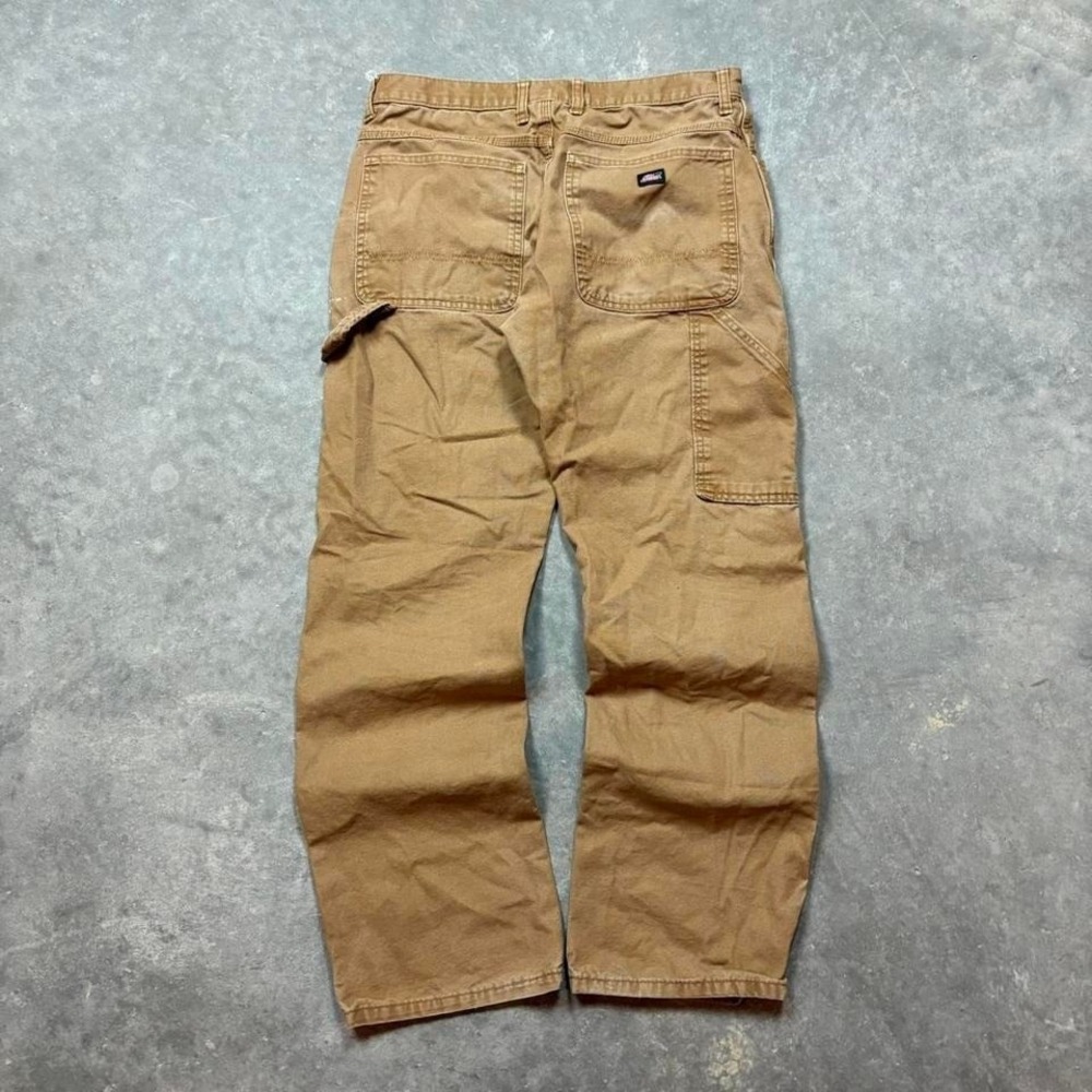 Tan Dickies carpenter pants with a relaxed fit
